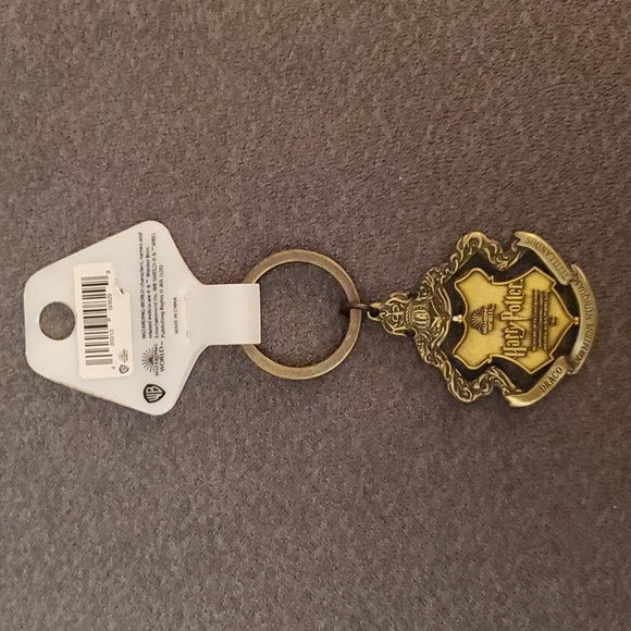 NWT Harry Potter metallic pivotal keychain. Four houses. From NYC store. - Picture 3 of 7